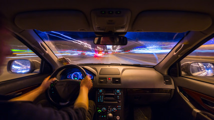 Night city road view from inside car
