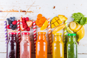 Fototapety  Selection of colourful smoothies on rustic wood background