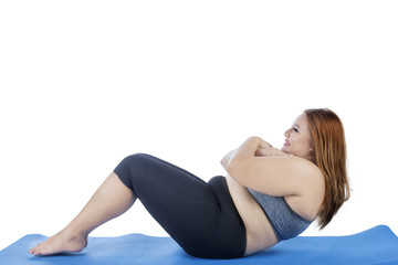 Fototapeta premium Obese woman doing sit-up