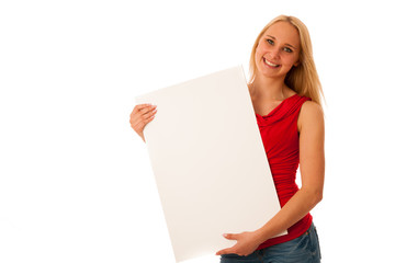 Cute blond woman with blank white banner in her hands smiling isolated over white background