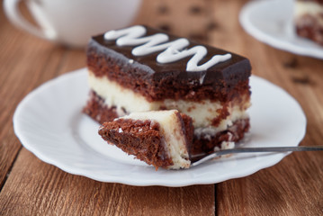 Delicious dessert cake with  cream and coffee