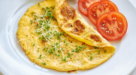 omelette with vegetables and bread. close up