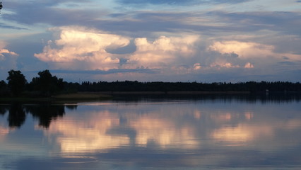 Obraz na płótnie Canvas Evening landscape after a thunderstorm .Ukraine , the Dnipro river,the city of New Kakhovka.