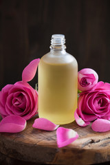 Fototapeta na wymiar Essential oil and rose flowers aromatherapy spa perfumery