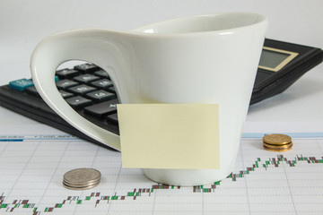 Finance chart calculator money and cup of coffee with a copy space for writing
