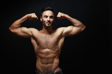 Fototapeta na wymiar young man with big muscles
