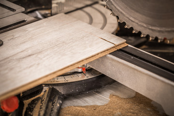 a man working with electric saw