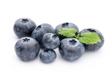 Close up of a blueberry branch isolated over white.
