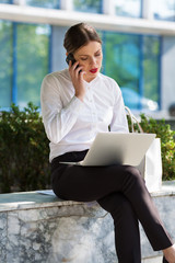 Business woman working outdoors