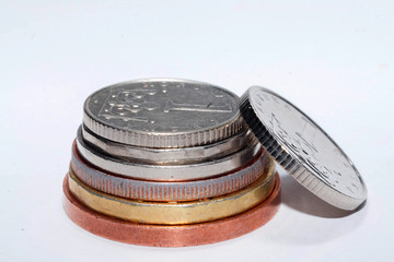 Czech coins of different denominations isolated on a white background. Lots of Czech coins. Macro photos of coins. Various Czech coins.