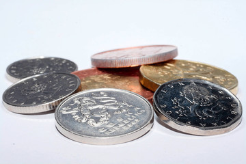 Czech coins of different denominations isolated on a white background. Lots of Czech coins. Macro photos of coins. Various Czech coins.