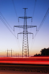 Fototapeta na wymiar Pylon and transmission power line in sunset.
