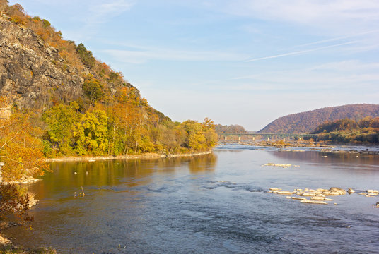 Potomac River in Harpers Ferry National park, West Virginia, USA. Autumn landscape with river and mountains.