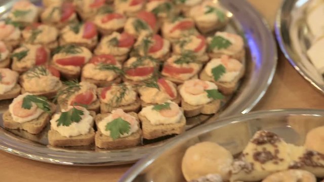 Profiteroles on a buffet table, banquet dish, buffet table in the restaurant, snacks, close up.