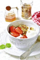 Healthy organic breakfast with granola,yogurt and strawberry.