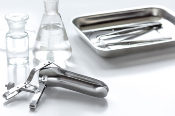 instruments of gynecologist on white background
