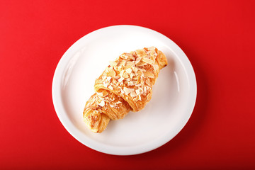 breakfast croissant on a red background
