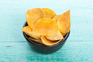 potato chips in a clay plate