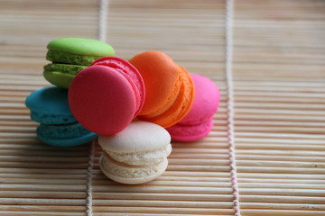 Mini Macarons on bamboo mat  colorful deserts