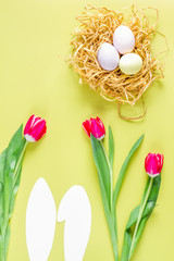 Easter concept on yellow background top view mockup