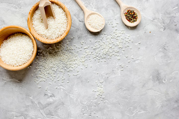rice for paella on stone background top view mock up