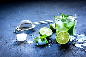 mojito in glass on dark background close up