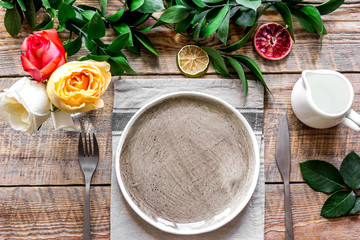 ceramic tableware top view on wooden background mock up