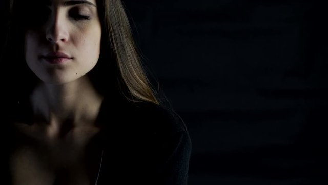 Portrait of beautiful young woman looking camera