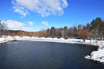 Landscape of the winter park with lake