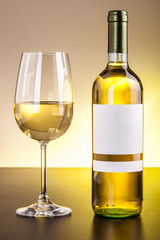 White wine glass and bottle