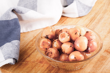 Lampascioni wild onions on wood