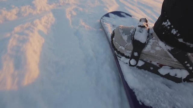 Snowboard riding close up (handheld shooting)