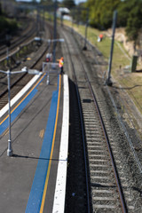 Railway workers High Visabilty Clothes maintenance tilt shift copyspace.