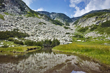 Fototapeta na wymiar Amazing Landscape of Muratovo lake, Pirin Mountain, Bulgaria