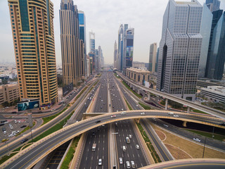 Fototapeta na wymiar beautiful aerial view of futuristic city landscape with roads, cars, trains, skyscrapers. Dubai, UAE