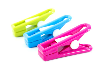 plastic clothespins on a white background.