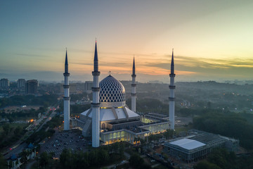 Aerial - Sunrise at a Mosque. Sultan Salahuddin Abdul Aziz Shah Mosque is Malaysia's largest mosque and also the second largest mosque in Southeast Asia.