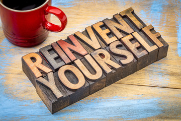 reinvent yourself - motivational words in wood type