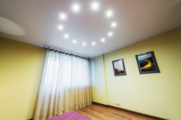 Interior of a new bedroom with a window and a picture on the wall