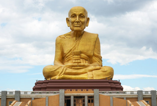 The Great Golden statue Monk at (Puttha Utthayan Maharat) Buddha Park in Ayutthaya, thailand
