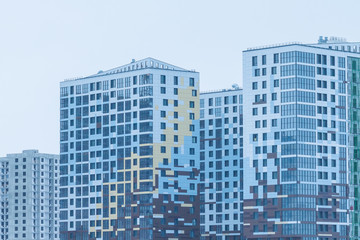 Obraz premium modern urban building under construction with a crane. Industrial Building Construction.modern residential quarter of the city 