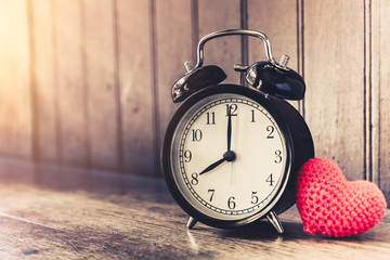 Love clock vintage tone timed 8 o'clock, Time of sweet loving past memories story on the old wood...