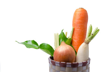 Fresh vegetables Raw Carrot,onion,radish in basket isolated on white background