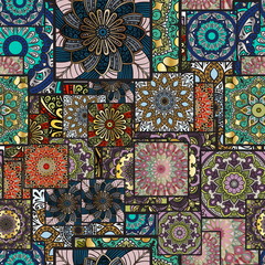 Colorful floral seamless pattern from squares with mandala in patchwork boho chic style, in portuguese and moroccan motif