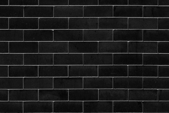 black paint clean brick wall for background.