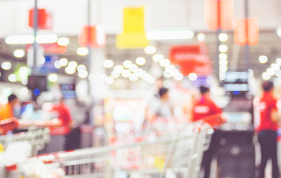 Blurred background of customer shopping at supermarket store blur background with bokeh