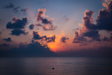 Beautiful sunrise behind dark clouds