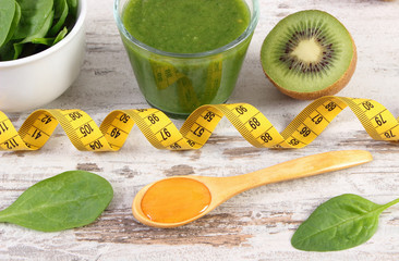 Ingredients, fresh cocktail from spinach and centimeter on wooden background, healthy nutrition and...