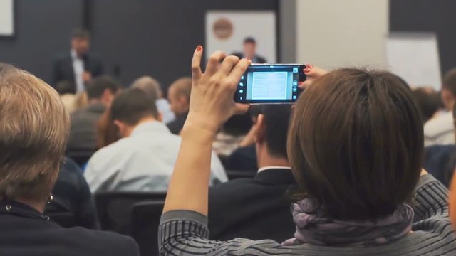 Business presentation seminar event. Students draw a hand, ask a question, raise a hand
