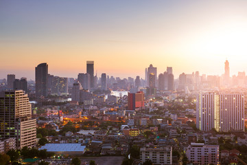 Bangkok skyline sunrise with downtown and business area view.